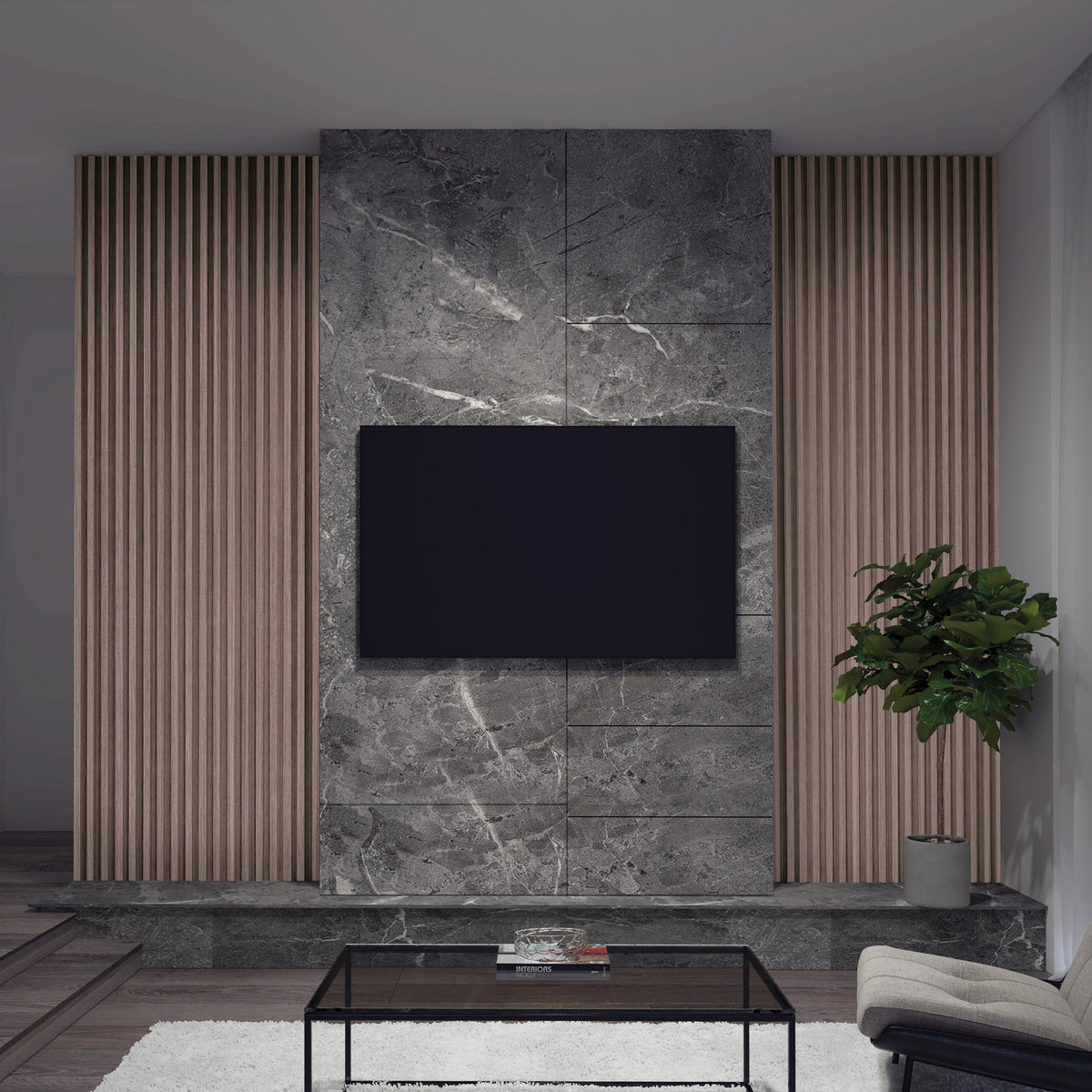 A modern living room wall features a mounted flat-screen TV, gray marble paneling, and Artika’s Panolok 30.67 ft wall panel kit (pack of 8) in oak finish as vertical slat panels, plus a potted plant, glass coffee table, and white Scandinavian rug.