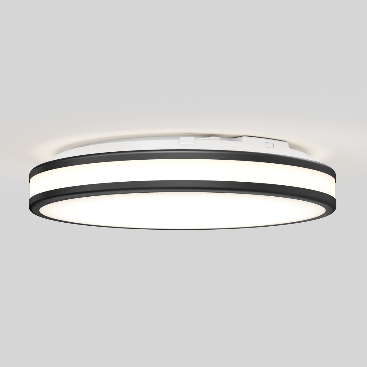 The Artika Hemisphere 15 in. LED flush mount light 5 CCT features a modern round design, adjustable brightness, a white center panel, black outer ring, and is shown mounted on a light gray ceiling.