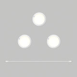 Three round, white puck lights arranged in a triangle on a gray background, with a single white USB cable laid horizontally below them.