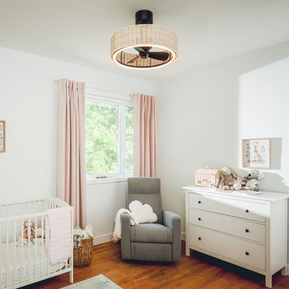 Bright nursery with crib, gray armchair, white dresser, stuffed animals, pink curtains, and Artika Kalani 24 in. LED fandelier with remote.