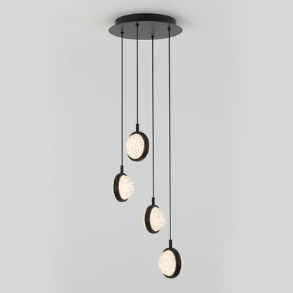A modern ceiling light fixture with four round, illuminated pendants hanging at different lengths from a circular black base against a plain light gray background.