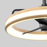 A close-up view of a modern ceiling light fixture with a circular wooden frame and integrated LED lighting, featuring black metal supports, set against a plain gray background.