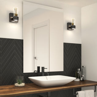Modern bathroom with vessel sink, square mirror, black chevron tile walls, and Artika Essence 1-light LED vanity lights on each side.