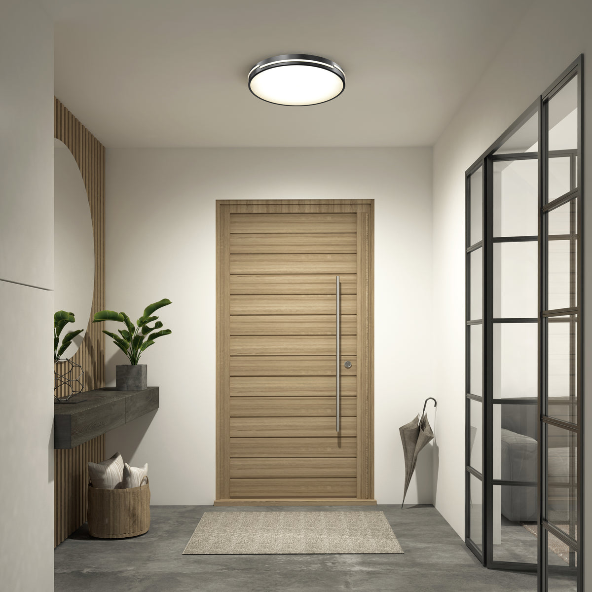 Modern entryway with a wooden door, minimal decor, wall shelf with plants, round mirror, basket of blankets, umbrella, glass partition, and an Artika Delray 15.7 in. LED modern flush mount light 5 CCT—all in neutral tones.