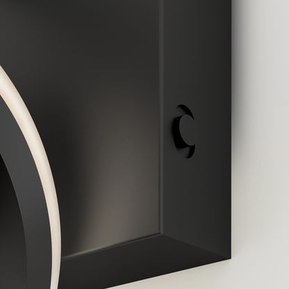Close-up of the Artika Vivaldi LED contemporary bathroom vanity light 3 CCT, a black rectangular fixture with smooth edges and a circular indentation. A curved, illuminated white line runs along its left edge, set against a white background.