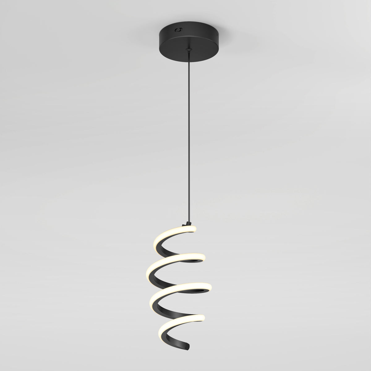 The Artika Chorus 1-light LED pendant features a modern, ribbon-inspired spiral design with a black base, suspended from the ceiling and offering soft white decorative lighting—ideal for contemporary spaces.