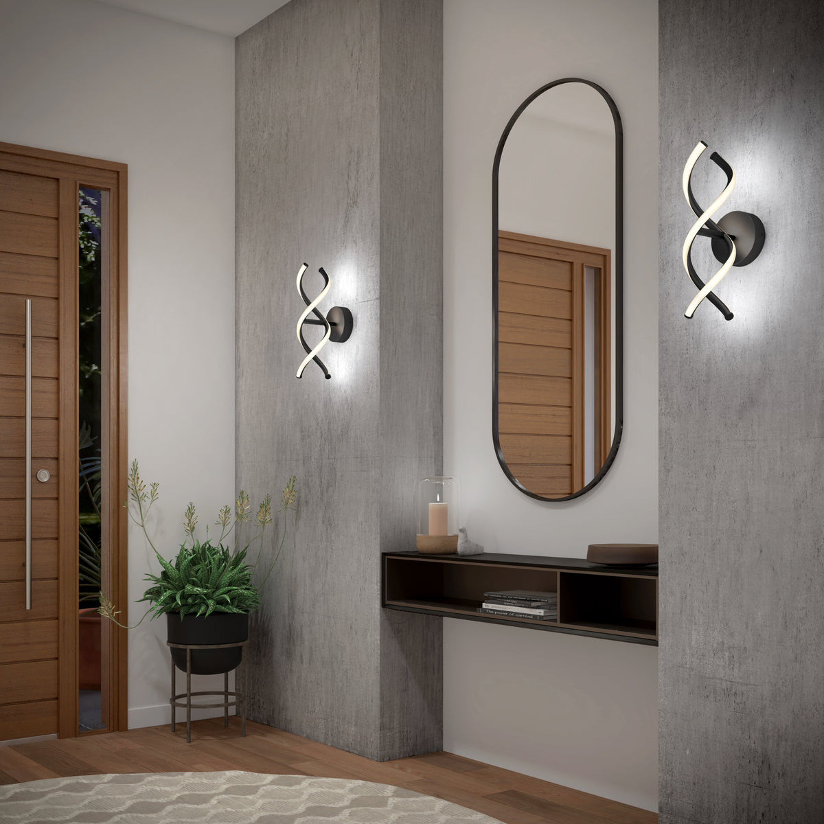 Modern entryway with concrete walls, a round wooden door, an oval mirror above a floating shelf, two spiral-shaped wall sconces, a potted plant, and a circular rug on the floor.