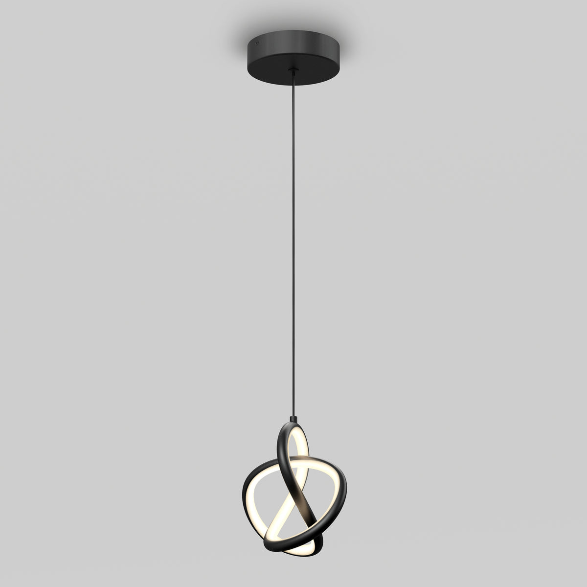 A modern pendant light with interlocking black rings and integrated LED lighting hangs from a ceiling on a black cord against a plain light gray background.