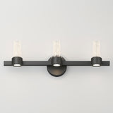 Modern black three-light wall sconce with a horizontal bar, cylindrical glass shades, and a circular wall mount, set against a plain white background.