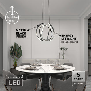 Modern dining room with a round table and four chairs under the Artika Vivaldi Big LED pendant light 5 CCT—featuring adjustable height, energy efficiency, integrated LED, and a 5-year warranty.