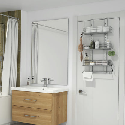 Modern bathroom with a wooden vanity, white sink, and large mirror; a bathtub with a white curtain is on the left. On the right, a white door features the Artika Camden Shower Caddy holding toiletries, towels, and bath accessories.
