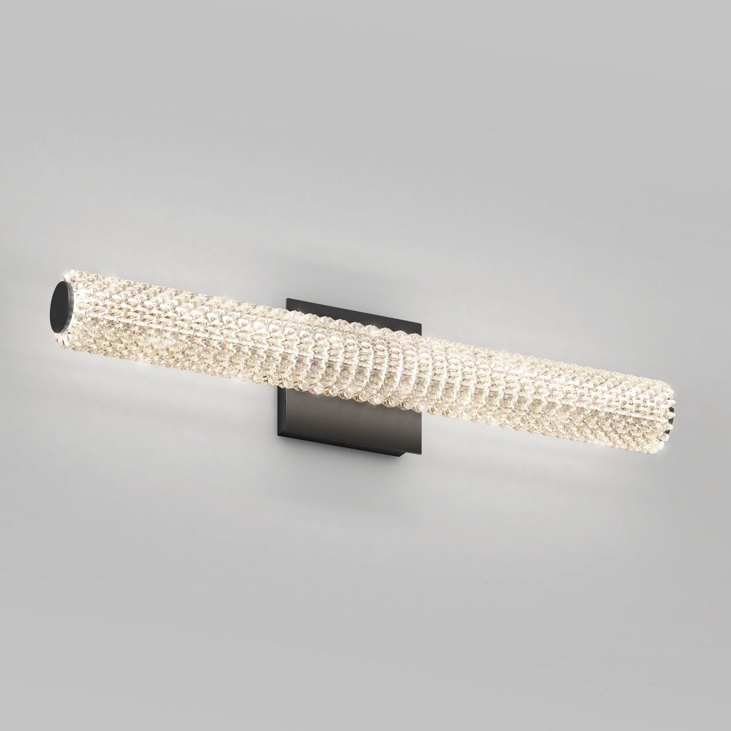 The Artika Exalto modern LED bathroom vanity light features a dimmable, crystal-accented cylinder on a square black base.