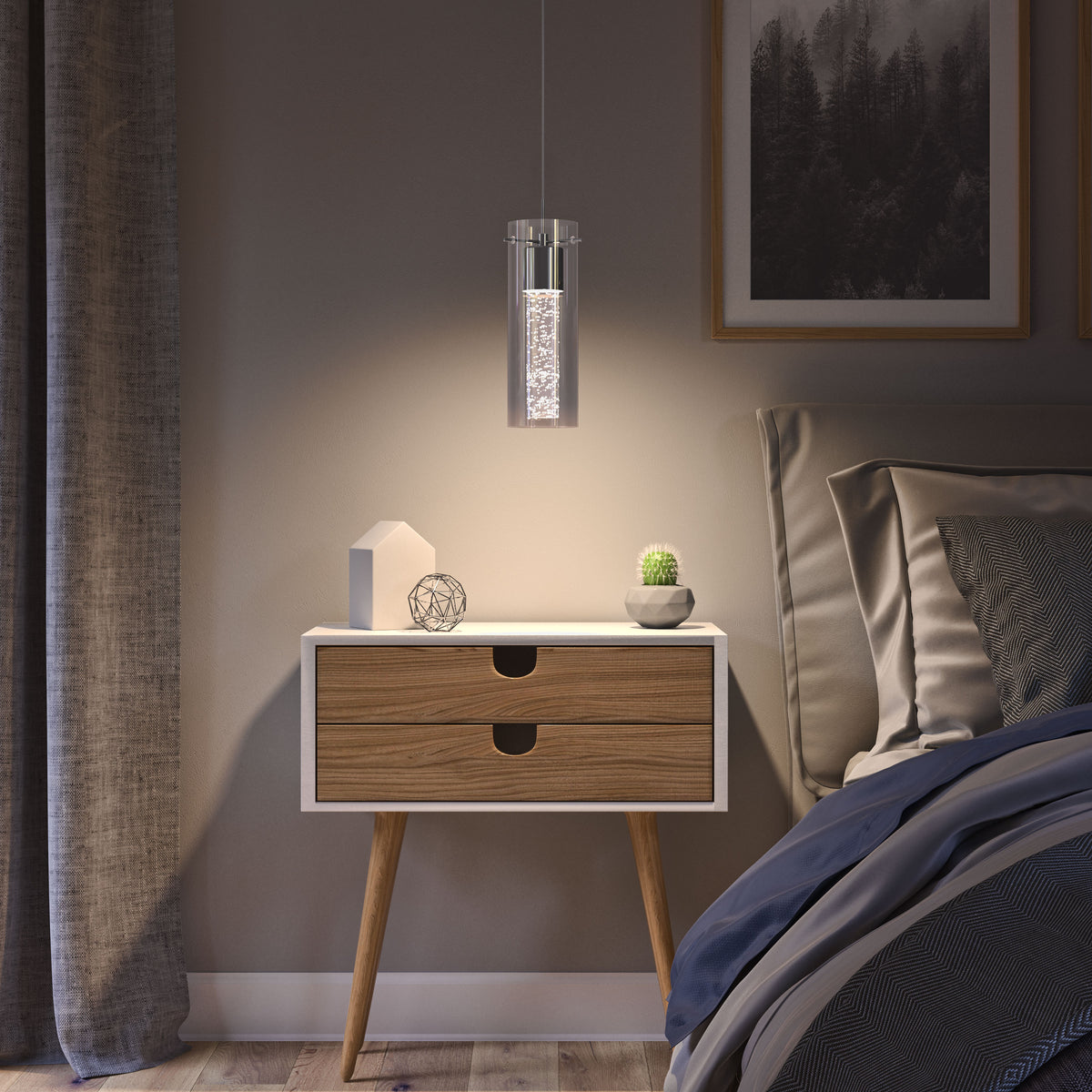 A modern bedroom nightstand with angled wooden legs holds a small plant, a geometric ornament, and a decorative object. A pendant light hangs above, casting a warm glow. A bed and framed art are partially visible nearby.
