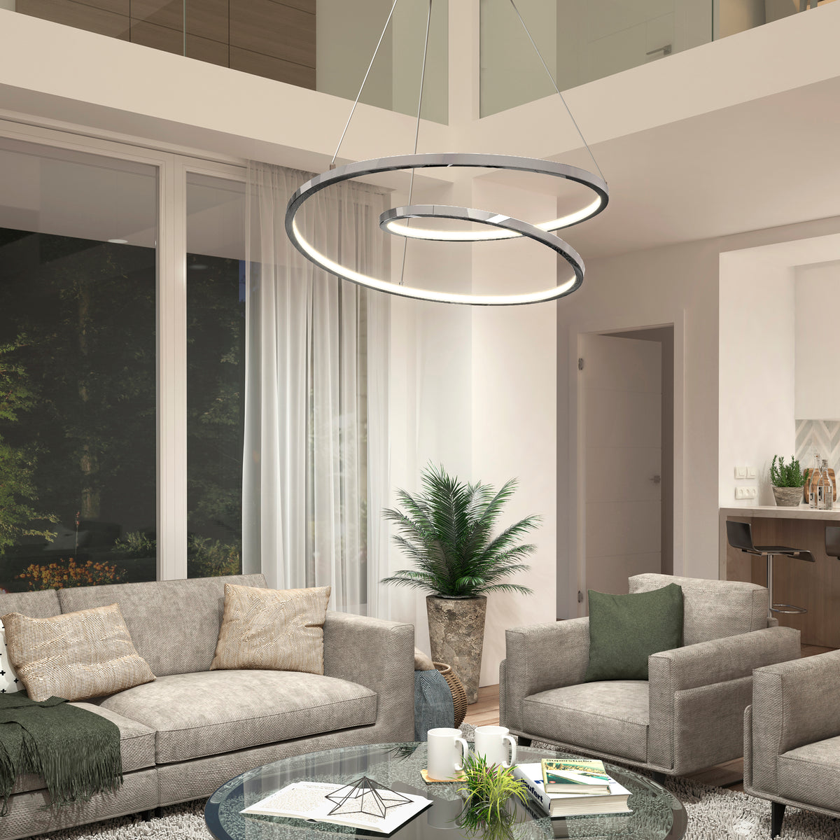 A modern living room with gray sofas, a round glass coffee table, a potted plant, floor-to-ceiling windows with sheer curtains, and a contemporary circular LED chandelier hanging from the ceiling.