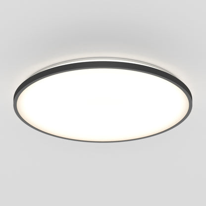 The Artika Europa 21 in. LED modern flush mount light features a black rim and bright diffused white center, blending seamlessly with a plain white ceiling; includes remote control for convenience.