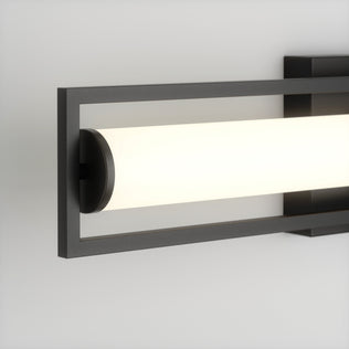 The Artika Rialto modern LED bathroom vanity light 3 CCT features a rectangular black metal frame and cylindrical frosted white diffuser, offering sleek, dimmable lighting for your space.