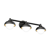A modern, black three-light wall sconce with round white glass shades, mounted on a horizontal bar against a white background.