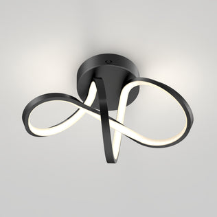 The Artika Loop modern LED flush mount light 3 CCT features a dimmable infinity-loop design on a white ceiling.