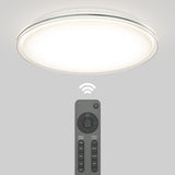A round, modern ceiling light emits a bright glow. Below it, a remote control with various buttons is shown, indicating wireless control of the light fixture.