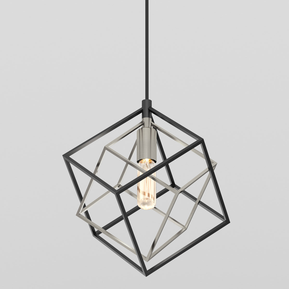 A modern pendant light featuring an exposed bulb surrounded by an open, geometric metal cube frame, suspended from a black cord against a plain light gray background.