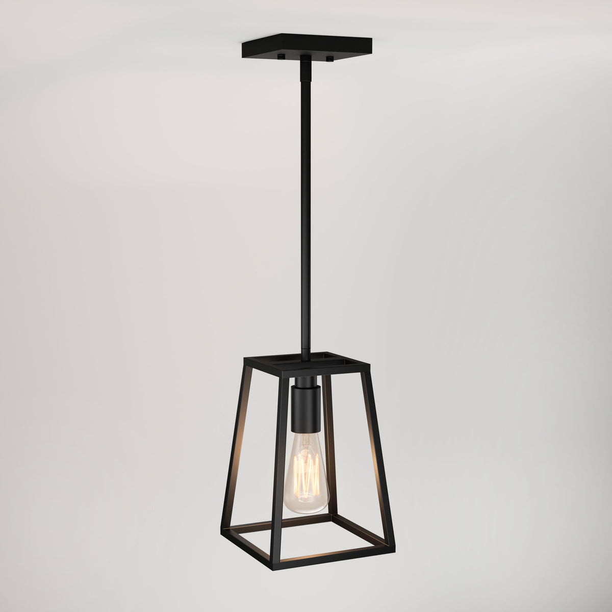 A modern black pendant light with a geometric metal frame and an exposed bulb hangs from a ceiling against a plain white background.