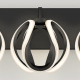 Modern ceiling light fixture with black and white curved LED strips forming a geometric, spherical shape, mounted on a flat black ceiling plate against a neutral background.