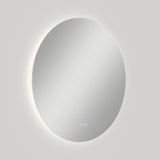 A round wall-mounted mirror with a soft backlight glow and two small touch buttons at the bottom, set against a plain, light-colored background.