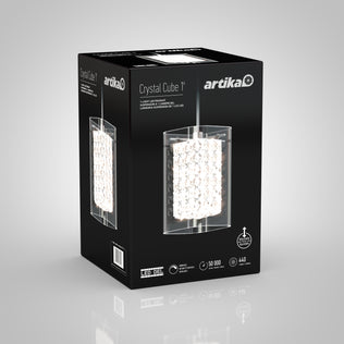 A black box with Artika branding displays the Crystal Cube 1-light LED pendant, featuring a cube design with sparkling crystal elements. Product features and technical details appear on a gray background.