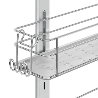A close-up of the Artika Camden Shower Caddy shows it mounted on a vertical rail, featuring a flat perforated tray and side hooks. The silver unit offers a modern, minimalist design ideal for organized bathroom storage.