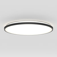 The Artika Europa 21 in. LED modern flush mount light features a black rim and bright diffused white light, mounted on a plain white ceiling, and comes with a remote for easy control.