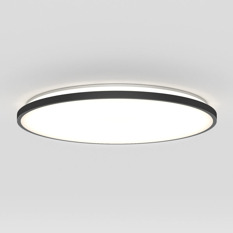 The Artika Europa 21 in. LED modern flush mount light features a black rim and bright diffused white light, mounted on a plain white ceiling, and comes with a remote for easy control.