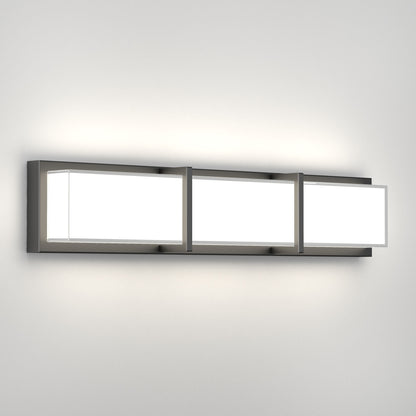 The Artika Subway LED bathroom vanity light features three rectangular white panels set in a metallic frame, providing a soft, even glow on your wall.