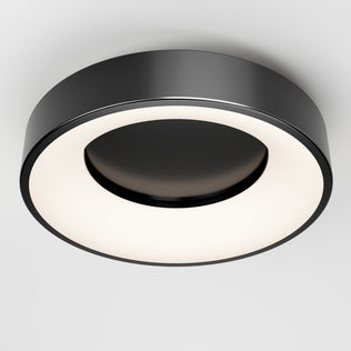 The Artika Aiden LED flush mount features a modern circular design with a matte black outer ring and glowing white inner ring, seamlessly mounted on a white ceiling.