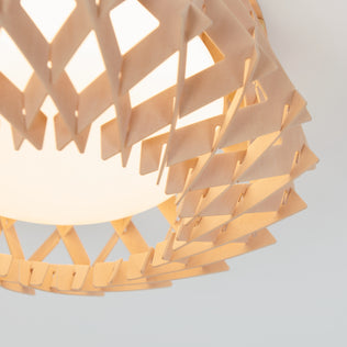 Close-up of the Artika Kiran 13 in. modern LED flush mount light (5 CCT), featuring a geometric wooden lattice design around a frosted globe that forms triangular patterns and emits soft, warm light.
