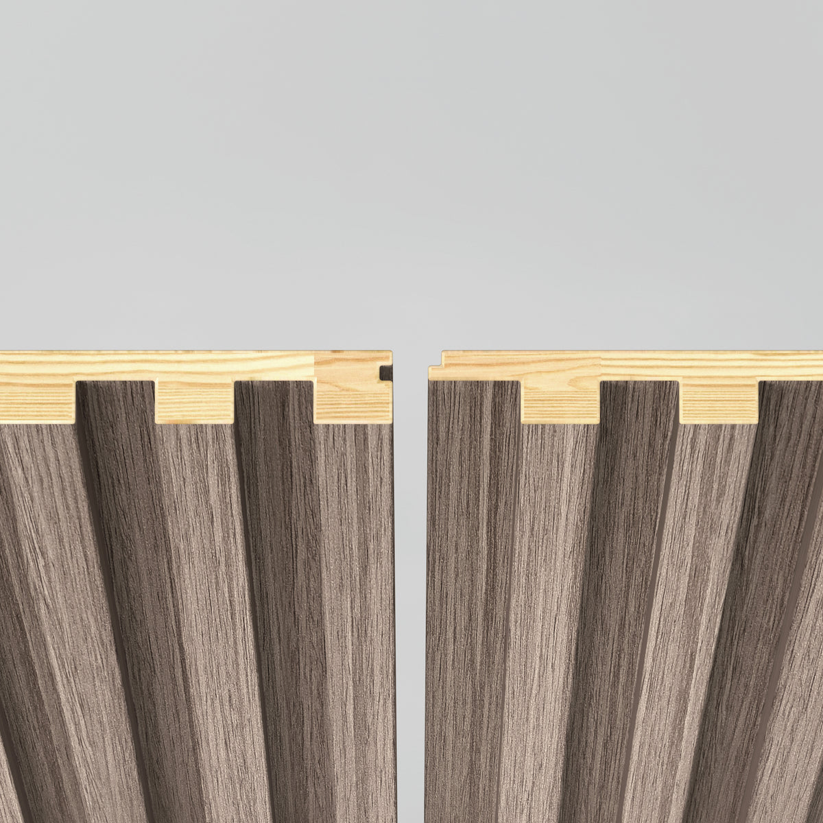 Two wooden panels with grooved, wavy surfaces and contrasting light wood edges are positioned side by side against a plain light background, with a small gap between them showing their interlocking design.