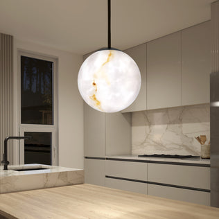 A modern kitchen with beige cabinets, marble backsplash, and countertops features the Artika Selena LED contemporary pendant light with marble-like patterns hanging above a wooden island.