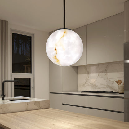 A modern kitchen with beige cabinets, marble backsplash, and countertops features the Artika Selena LED contemporary pendant light with marble-like patterns hanging above a wooden island.