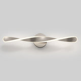 A modern wall light fixture with a twisted, ribbon-like metallic design and integrated LED illumination, mounted on a round base against a plain white background.