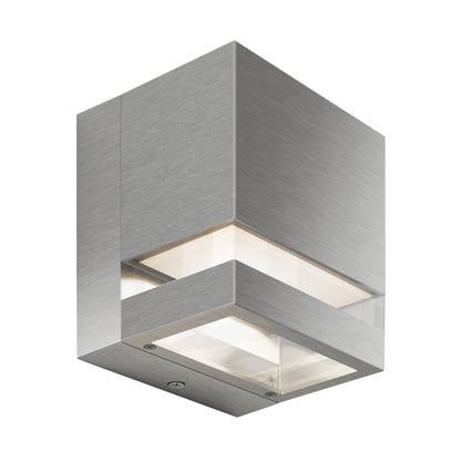 The Artika-CAN-dev Valor Square LED indoor/outdoor wall light features a modern square design with a brushed metal finish and clear glass panels on two sides, casting illumination from within.