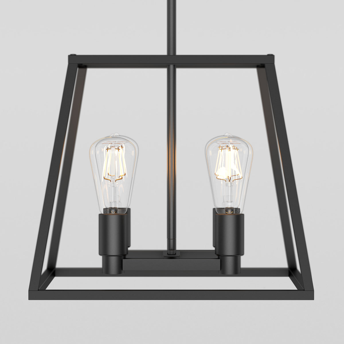 The Artika Carter Square 4-light Chandelier is a modern black metal fixture with a geometric open-frame design, featuring two exposed vintage-style filament bulbs, displayed against a plain light gray background.
