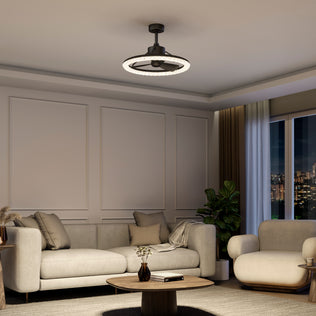 Modern living room with beige furniture, round coffee table, large plant, and Artika Carat 23" LED Ceiling Fan with remote.