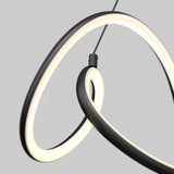 A modern pendant light with two intertwined, glowing LED rings suspended by a thin black wire against a plain gray background.