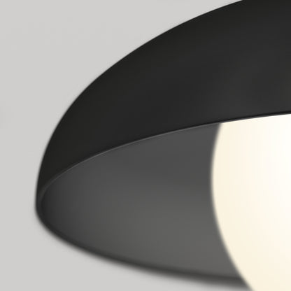 Close-up of the Artika Boden LED modern mid-century pendant light 3 CCT in black, featuring a partially covered glowing white bulb against a soft gray background.