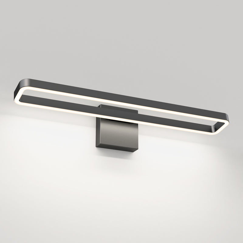 The Artika Hinge 27-in Integrated LED 3-CCT Vanity Light Bar, with a matte black rectangular design and square base, is mounted against a plain white wall.
