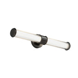 A modern wall-mounted light fixture with a horizontal cylindrical glass shade and black metal accents, attached to a round black base.