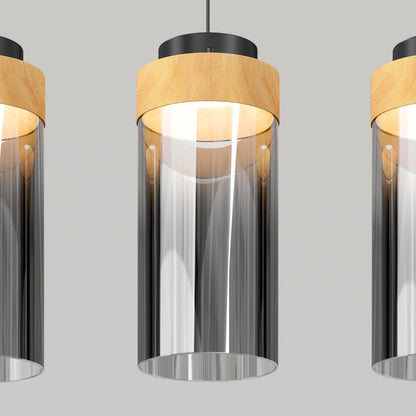 The Artika Hanson 4-light LED pendant features cylindrical glass shades, wooden accents, and black ceiling mounts. Evenly spaced, the modern lights hang against a light gray background, with some fixtures partially cropped at the edges.