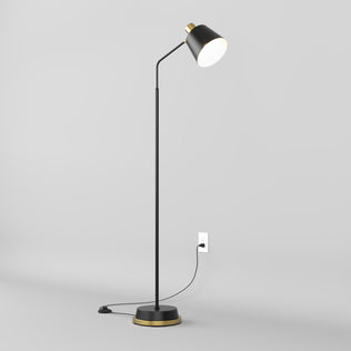 The Artika Alton LED modern floor lamp, featuring a black finish with gold accents, stands on a round base with a straight pole and angled shade, casting downward light against a plain light gray background.