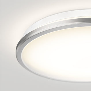 Close-up of the Artika Vera 13 in. Modern LED Flush Mount Ceiling Light, glowing softly against a light-colored ceiling.