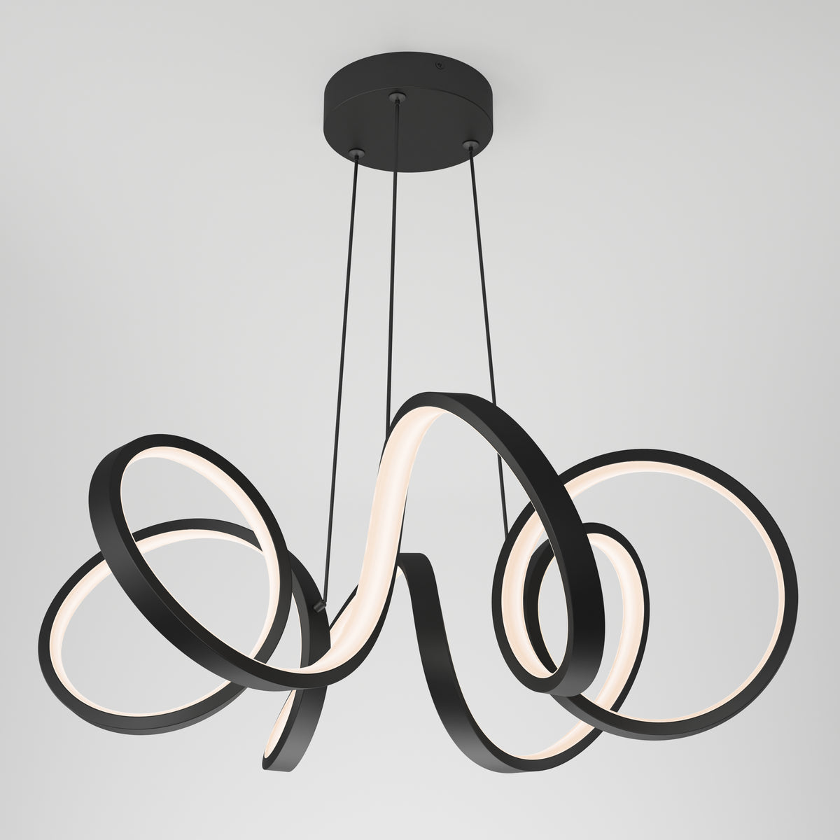 Modern ceiling light fixture with three black, looped LED rings suspended by thin cords from a round black base, creating an abstract, sculptural appearance against a white background.