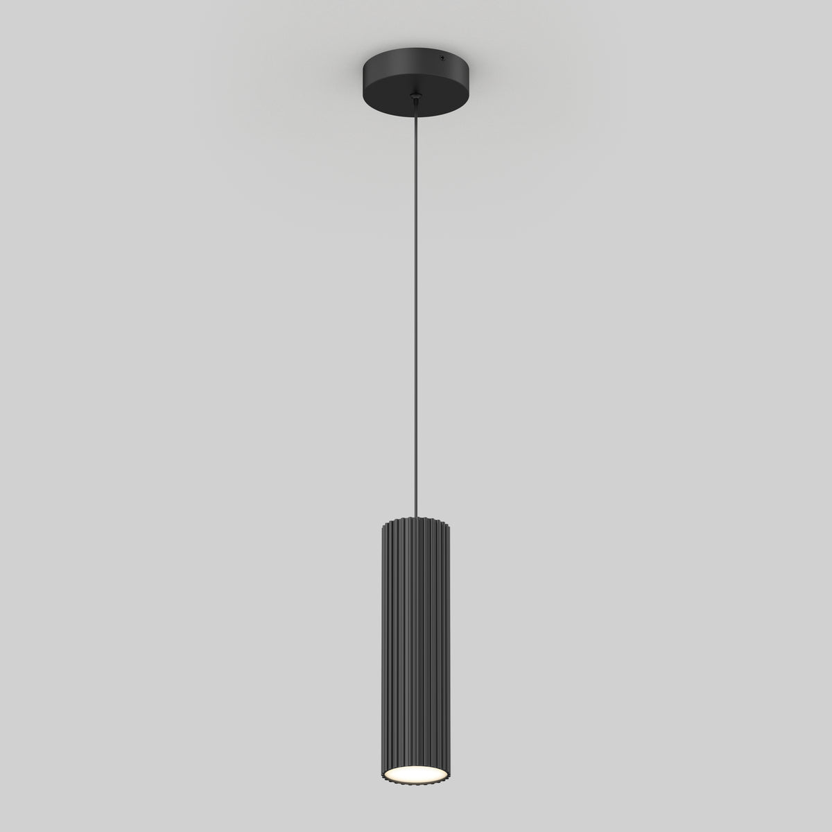The Artika Groove LED modern pendant light 3 CCT features a sleek black cylindrical, ribbed shade suspended by a thin cord, shown against a plain light gray background.